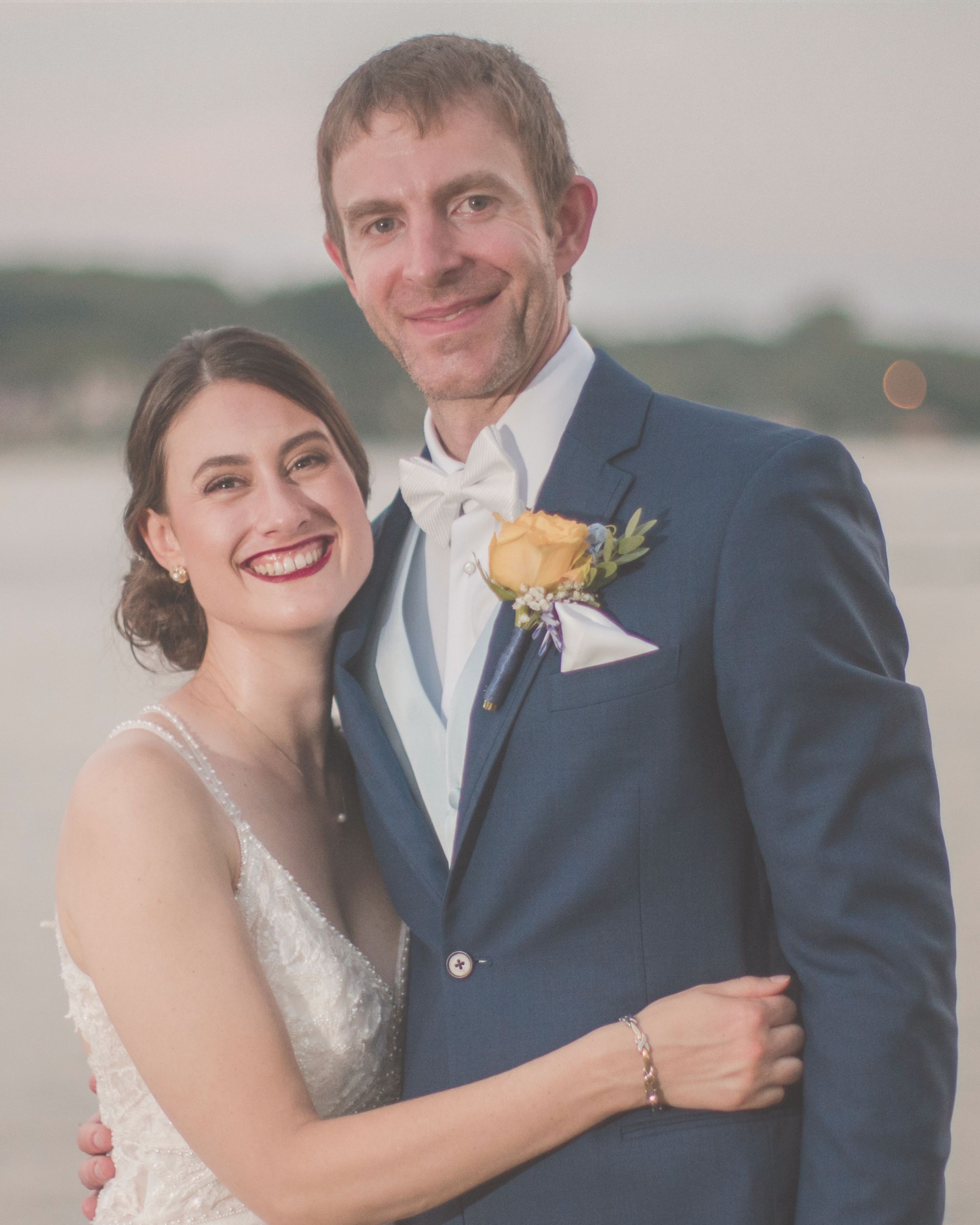 Newlywed couple at River View Lodge wedding venue overlooking the Mississippi River